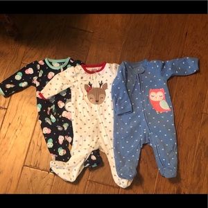 Three fleece pairs of footie pajamas